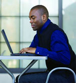 Image of a guy at a laptop