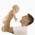 Image of a Man lifting a baby