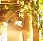 Image Women tending to plants on vacation