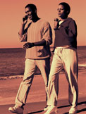 Image Male and Female walking on the beach