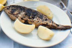 Image Cooked Fish with lemon slices