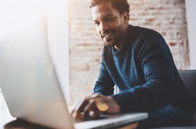 A male massage therapist using clinic management software