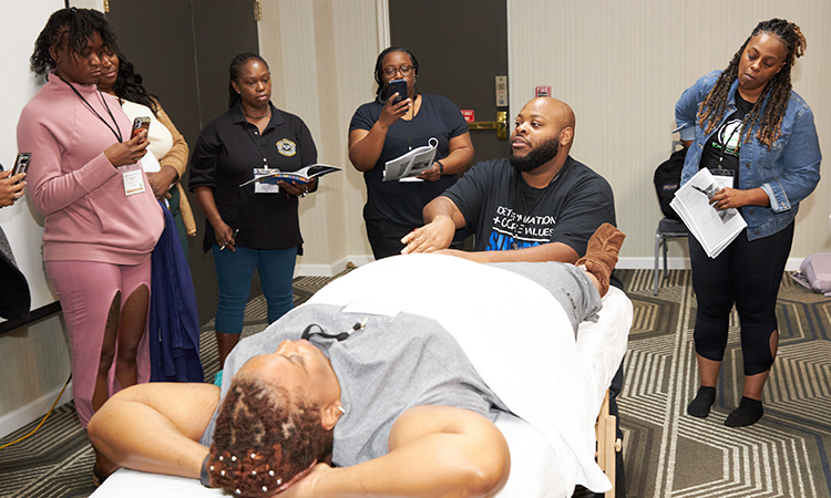Educator Terrance Bonner teaches a CE class on Thai foot reflexology.