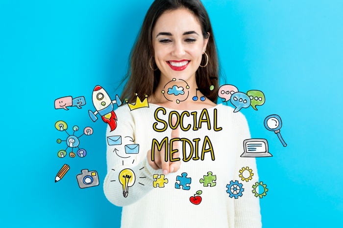 Social Media concept with young woman on blue background
