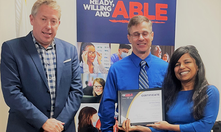 Amrita Garg being recognized for her role as a sponsor of registered apprenticeships for the Ready, Willing and ABLE project during National Apprenticeship Week. (L-R) Nicholas Wyman, president of IWSI America, Mark Erlichman, deputy director, Vocational Rehabilitation Employment Division. California State Department of Rehabilitation, and Amita Garg, campus director of Healthcare Career College.
