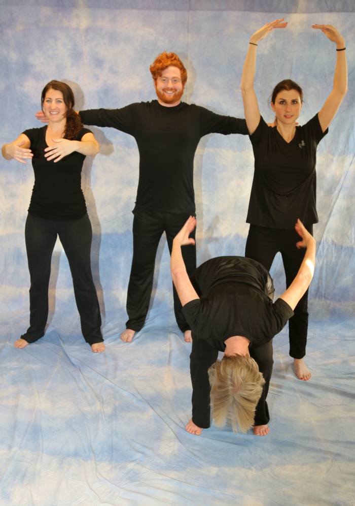 four yoga practitioners showing breath of joy