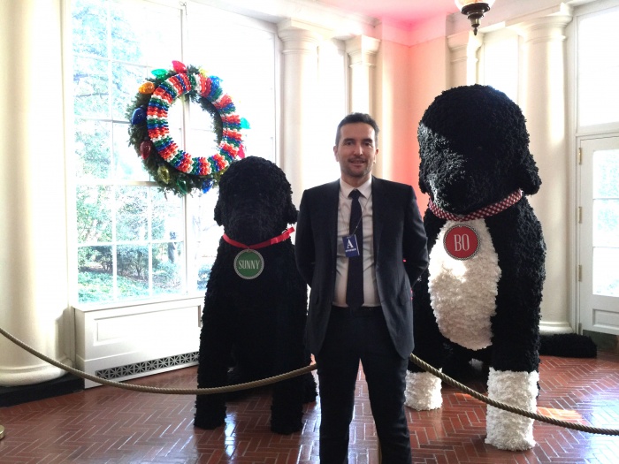 Antoine Chevalier LMT., standing with stuffed animals or Bo Obama's dogs