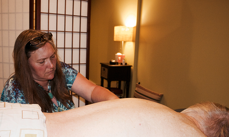 Cindy Hawks, a licensed massage therapist who helps mentor the clinical portion of the certificate program at Crouse Hospital.