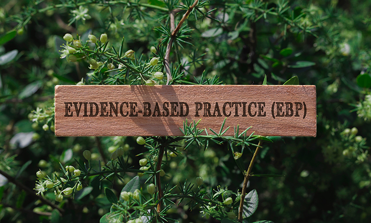 Photo of a sign that says "evidence-based practice," to coordinate with an article about evidence-based massage therapy practice.