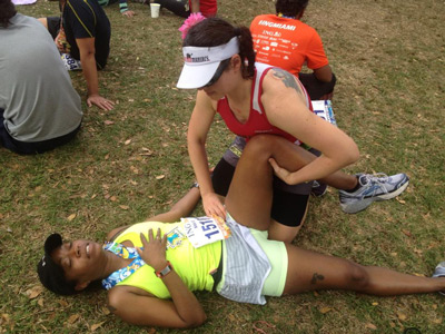 Julia Khvasechko works on a competitor at a marathon in Miami, Florida.