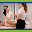 Image for an article about rethinking the interview process for massage therapists. Image of woman evaluating another woman's massage performance.