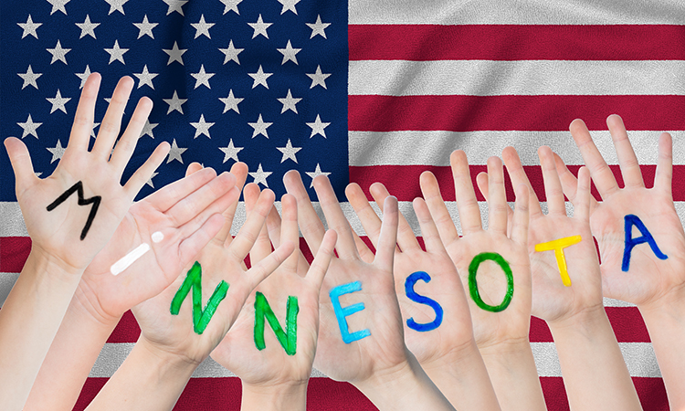 Nine human hands, palms out, are shown in front of a U.S. flag, with the word Minnesota spelled out on the palms, to illustrate legislation for Minnesota massage therapists.