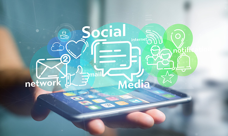 View of a Businessman holding a cloud of social media network icon