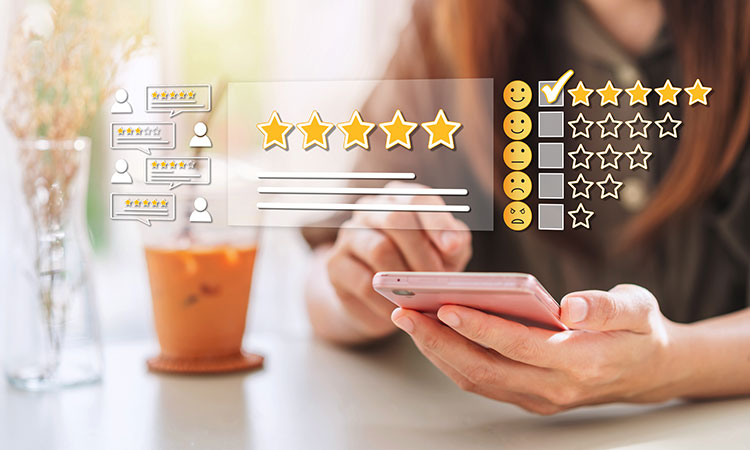 An image of a woman writing an online review on her smartphone is used to illustrate the concept of social proof, the collection of reviews and other feedback about you shared online by people you've worked with.