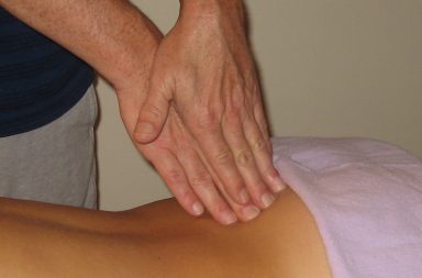 myofascial release training - massage therapist treating shoulder