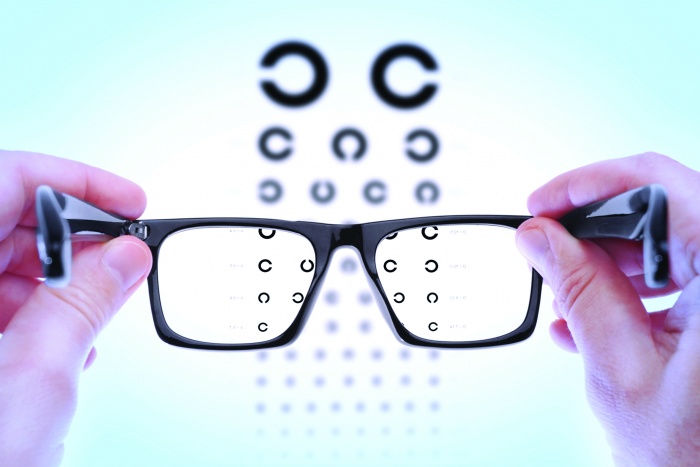 blurry vision test shown with glasses