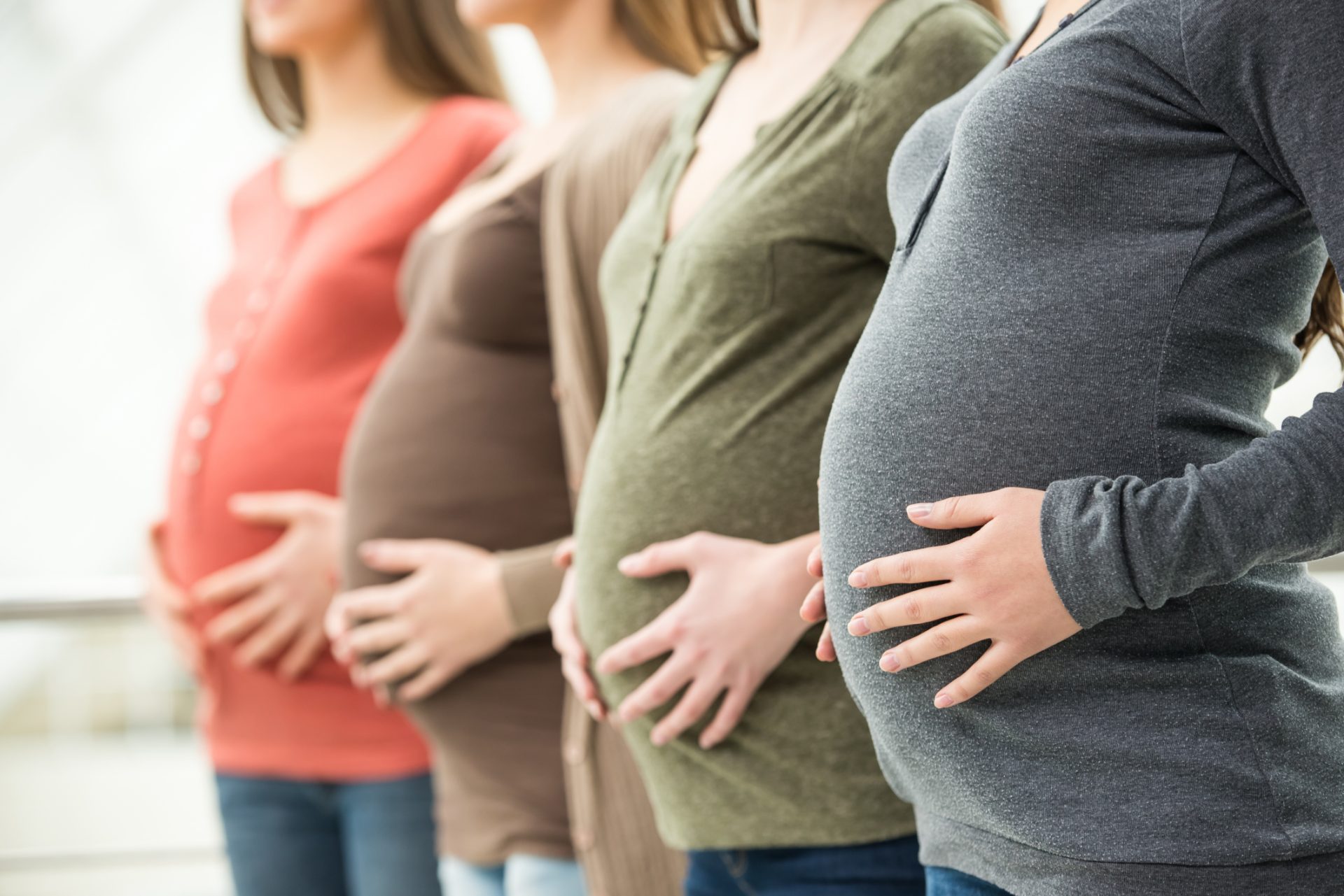 Four pregnant women in a row