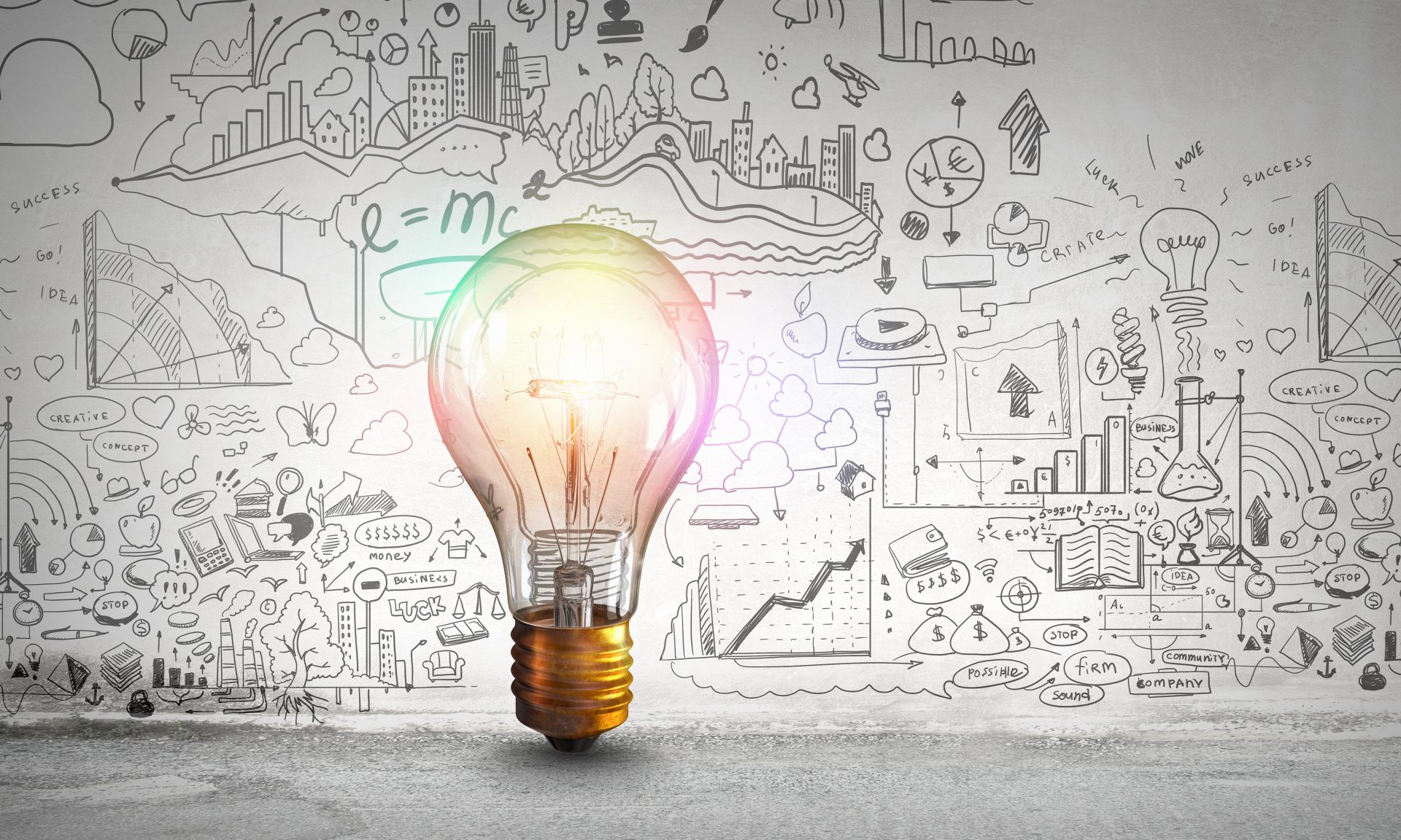 Featured image for an article about the top 5 mistakes to avoid when marketing your massage therapy business. Image of lightbulb with marketing symbols on a wall.